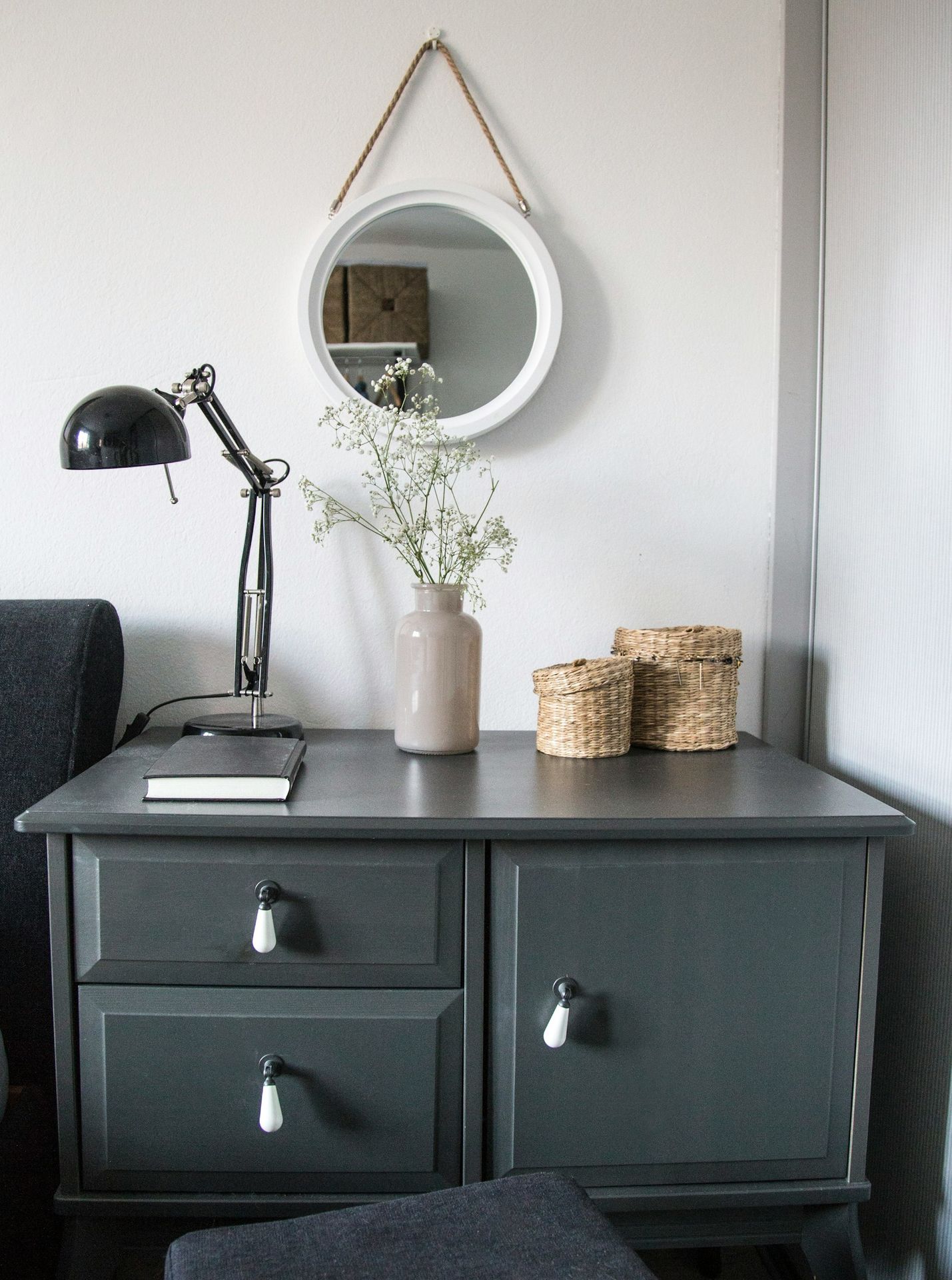 black desk lamp on black wooden drawer